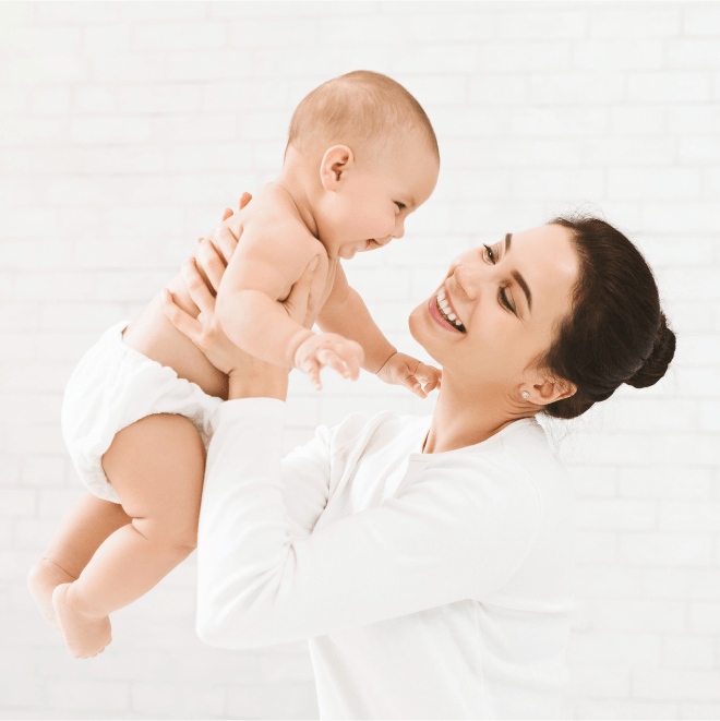 Mother and baby smiling 