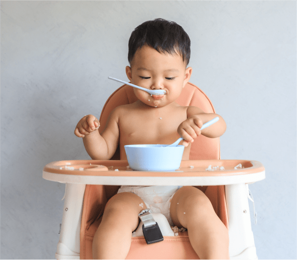 Baby eating on the chair